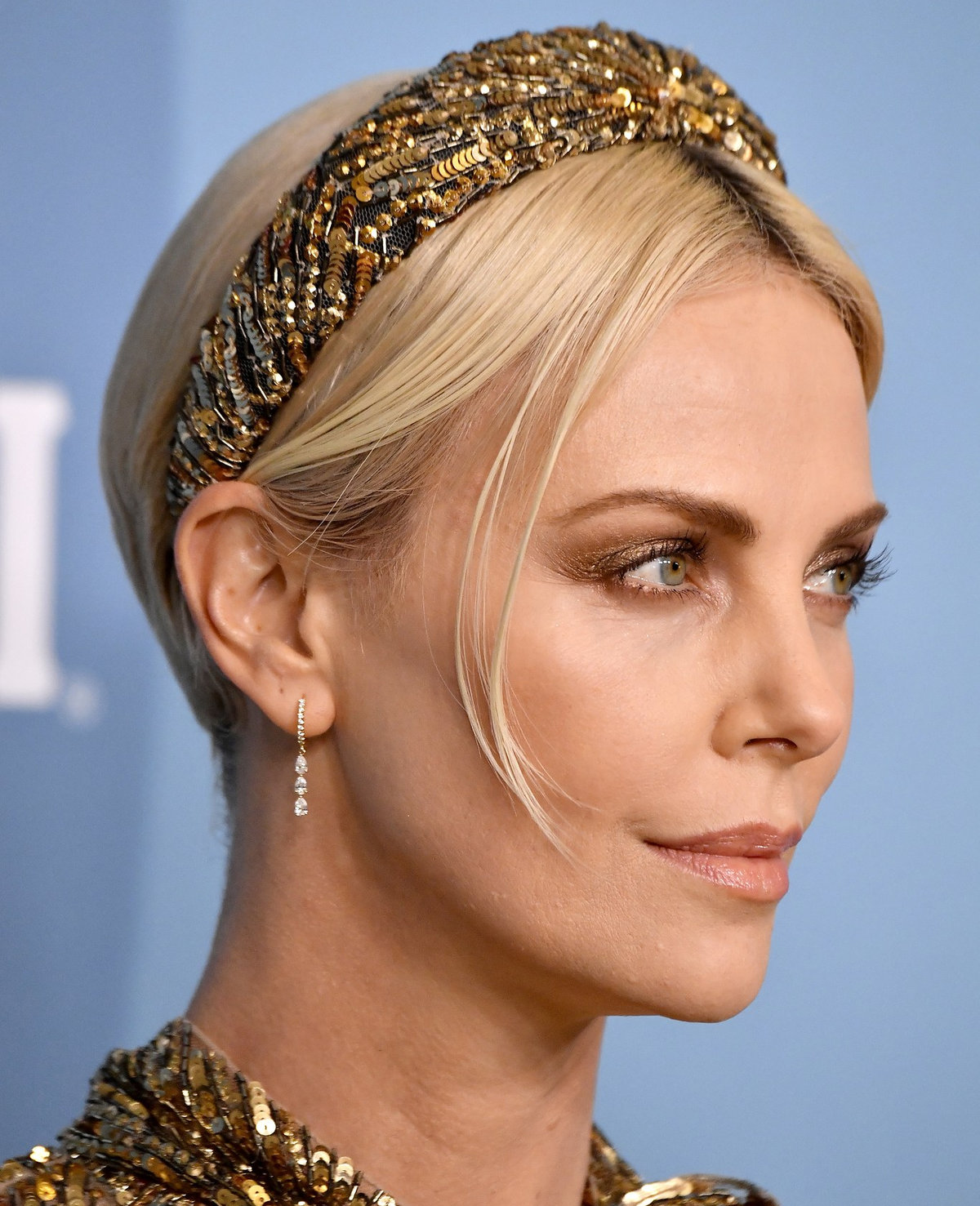 Charlize Theron Wears Custom Louis Vuitton Headband — Exclusive Interview